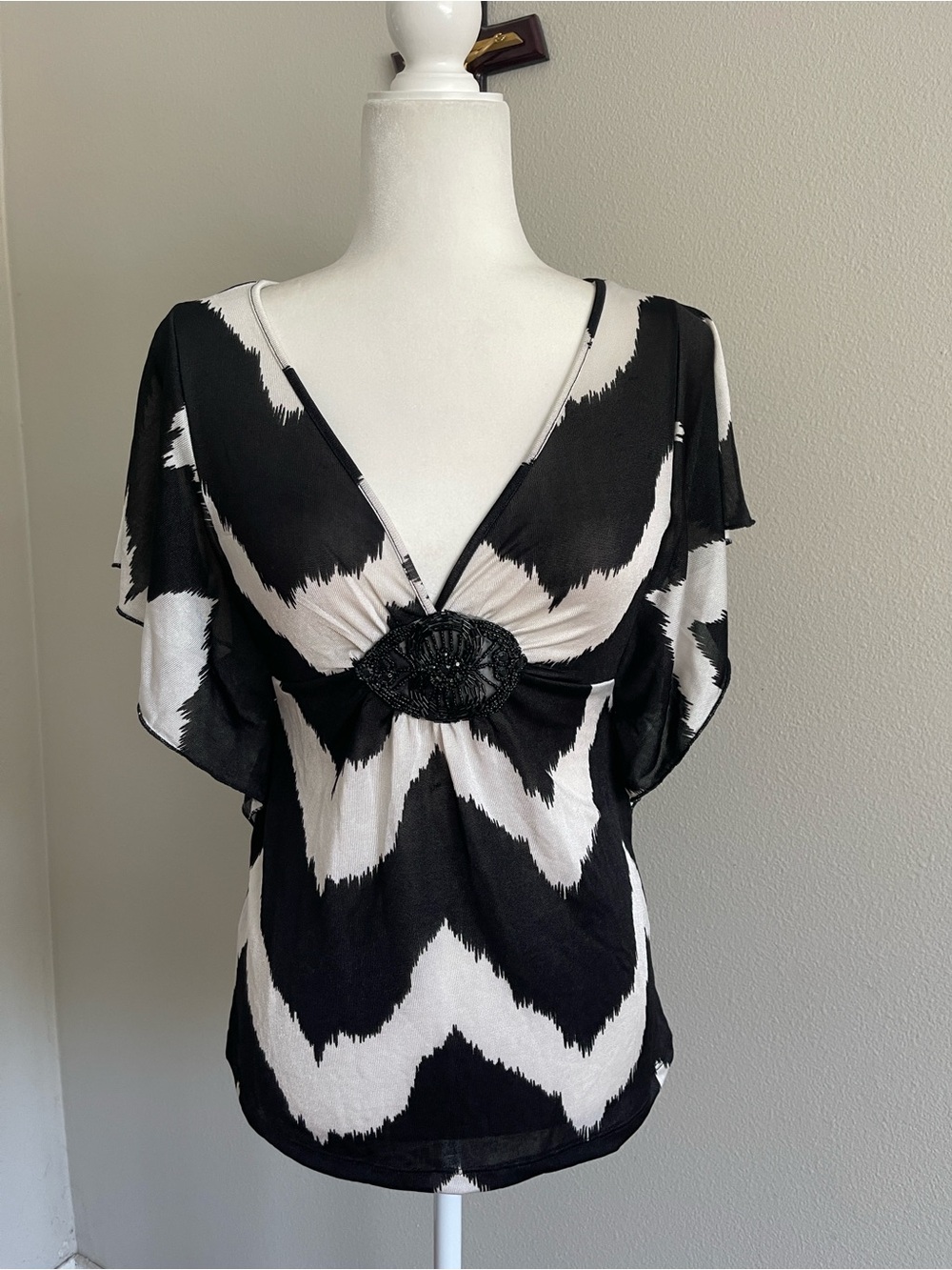 HeartSoul Black and White Chevron V-Neck Top with Beaded Medallion